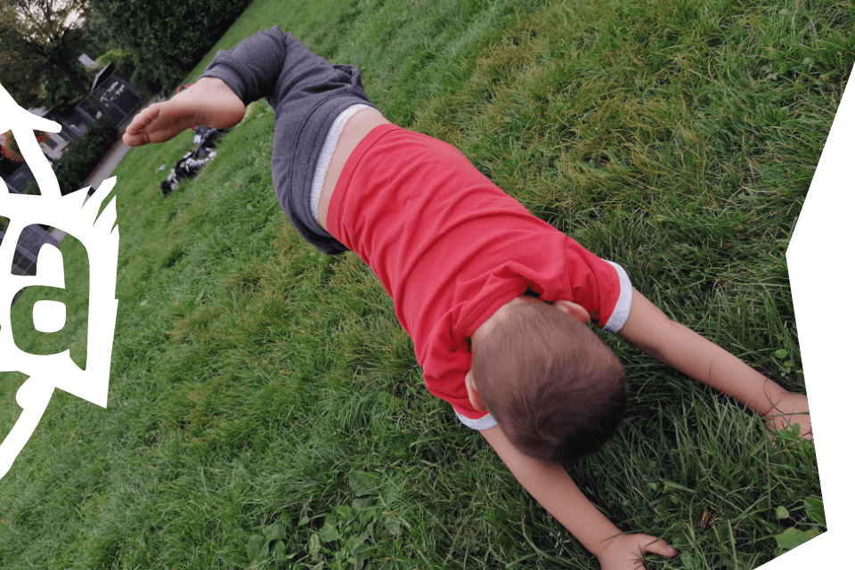 A child executes an Animal Flow movement